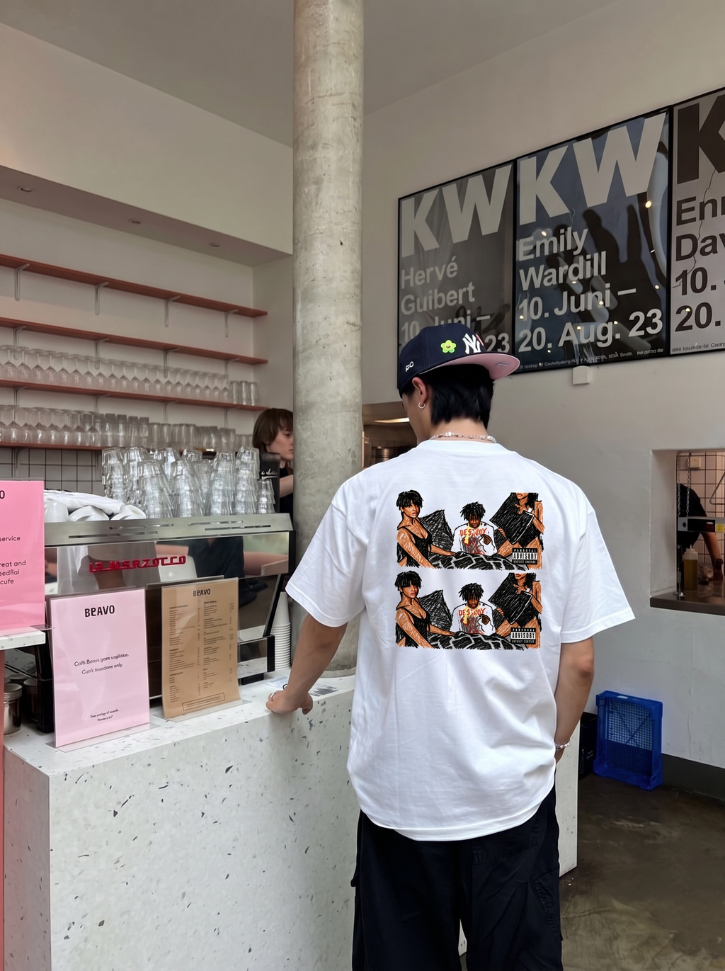 Playboi Carti tee, back print worn in a café