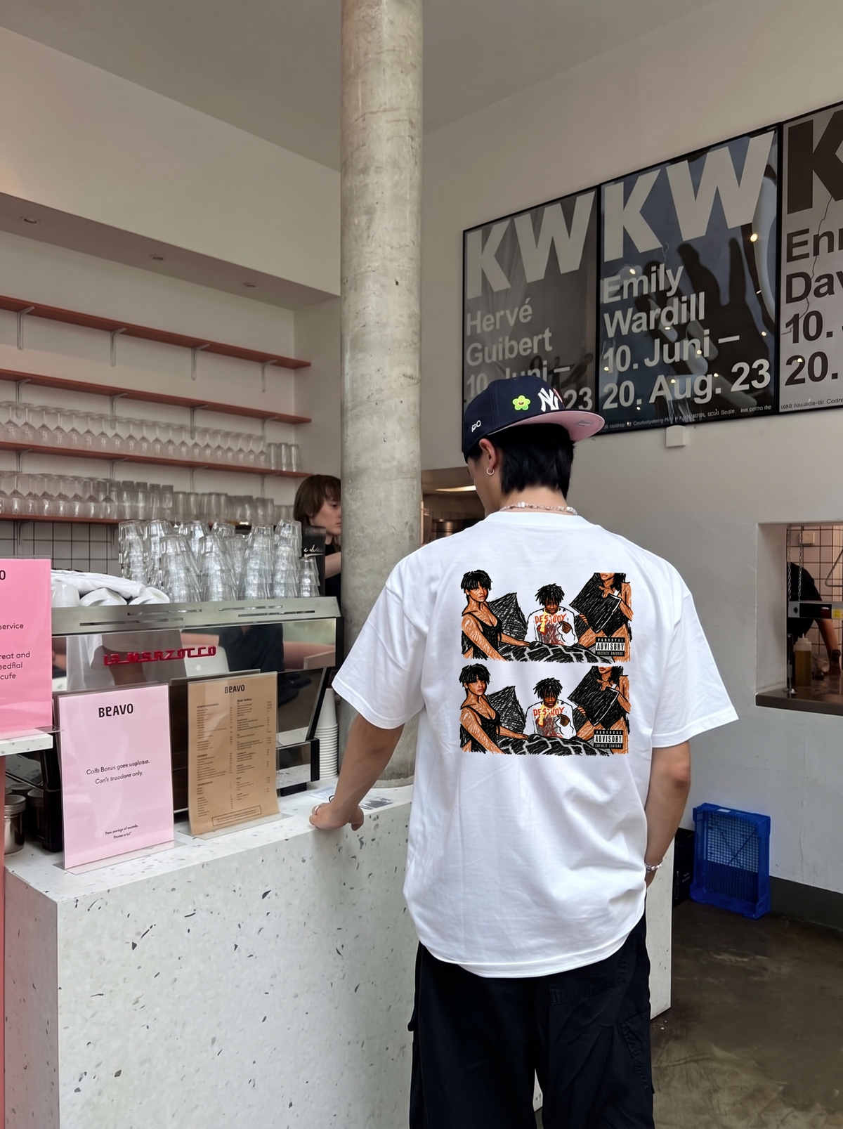Playboi Carti tee, back print worn in a café