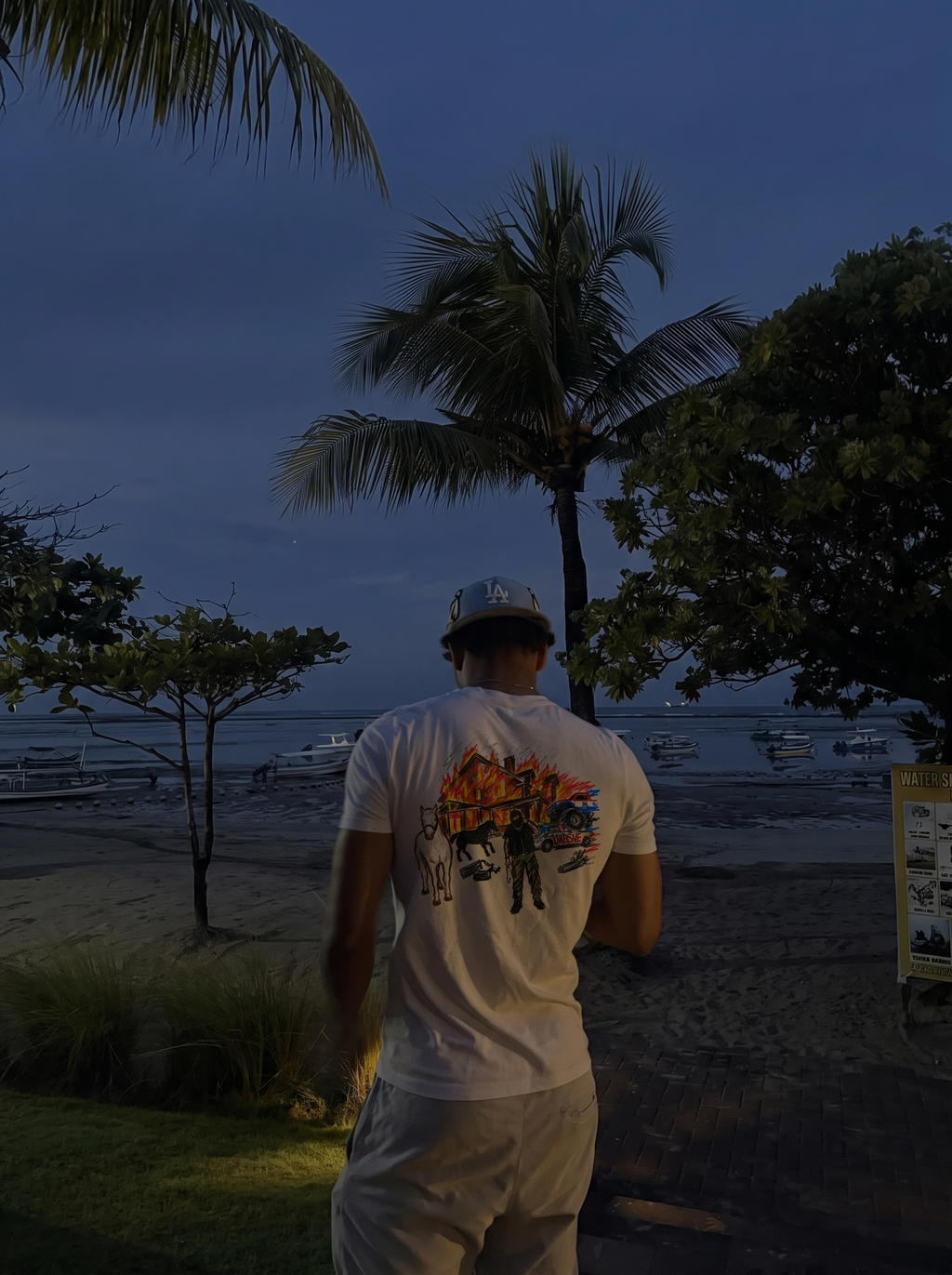 Lyfestyle tee, back print worn by the beach at dusk