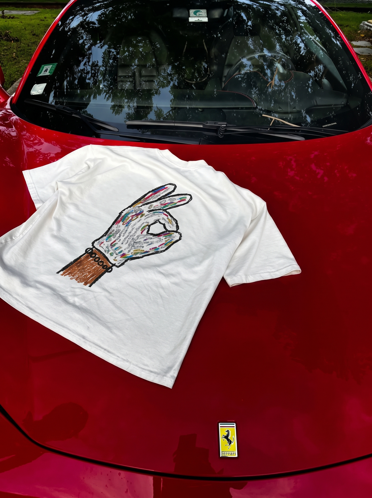 Iceman tee, back print laid on a red Ferrari