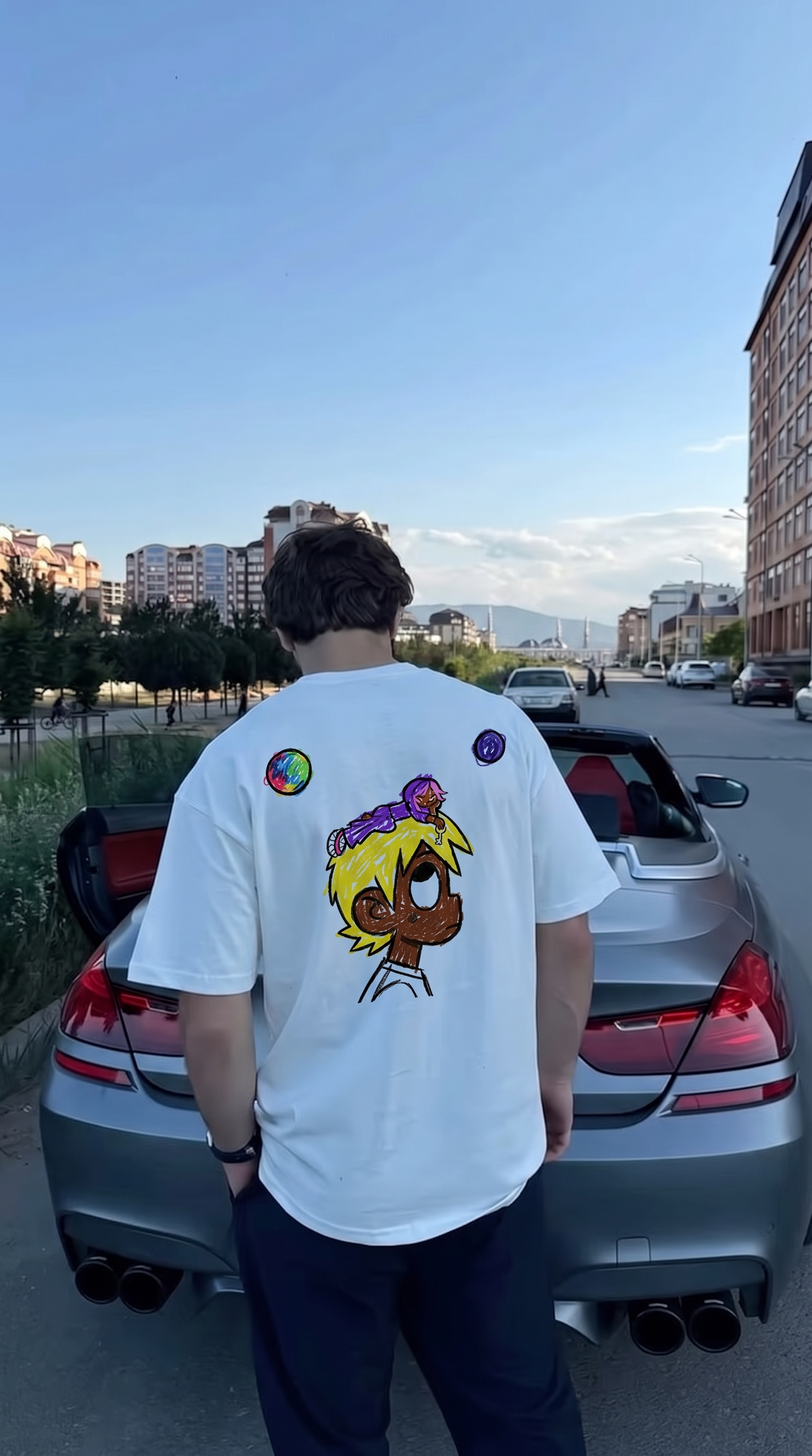 Baby Pluto tee, back print worn by a convertible