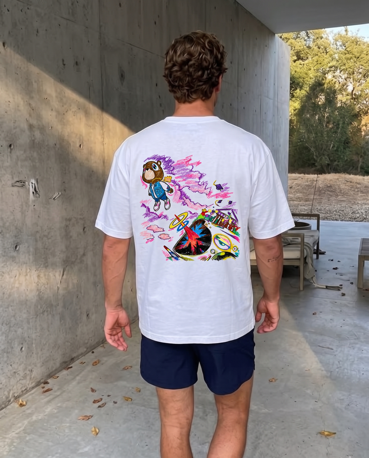 Graduation tee, back print worn on a concrete walkway