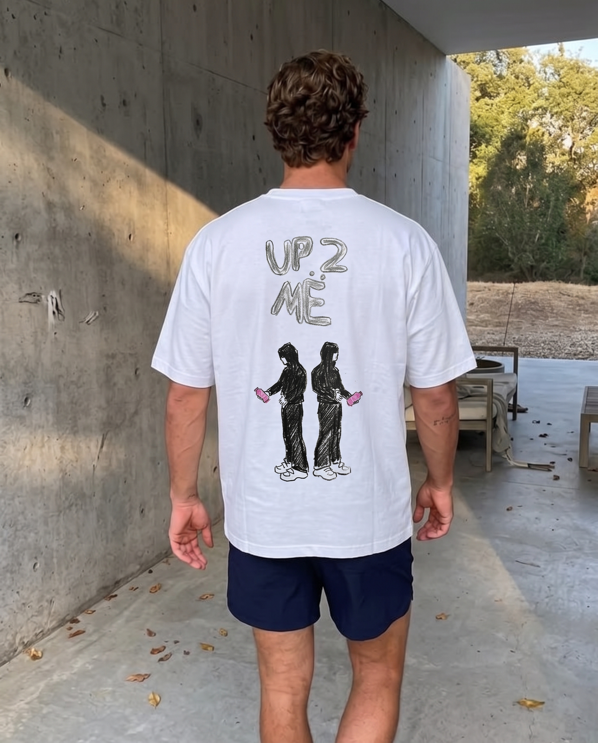 Up 2 Me tee, back print worn on a concrete walkway