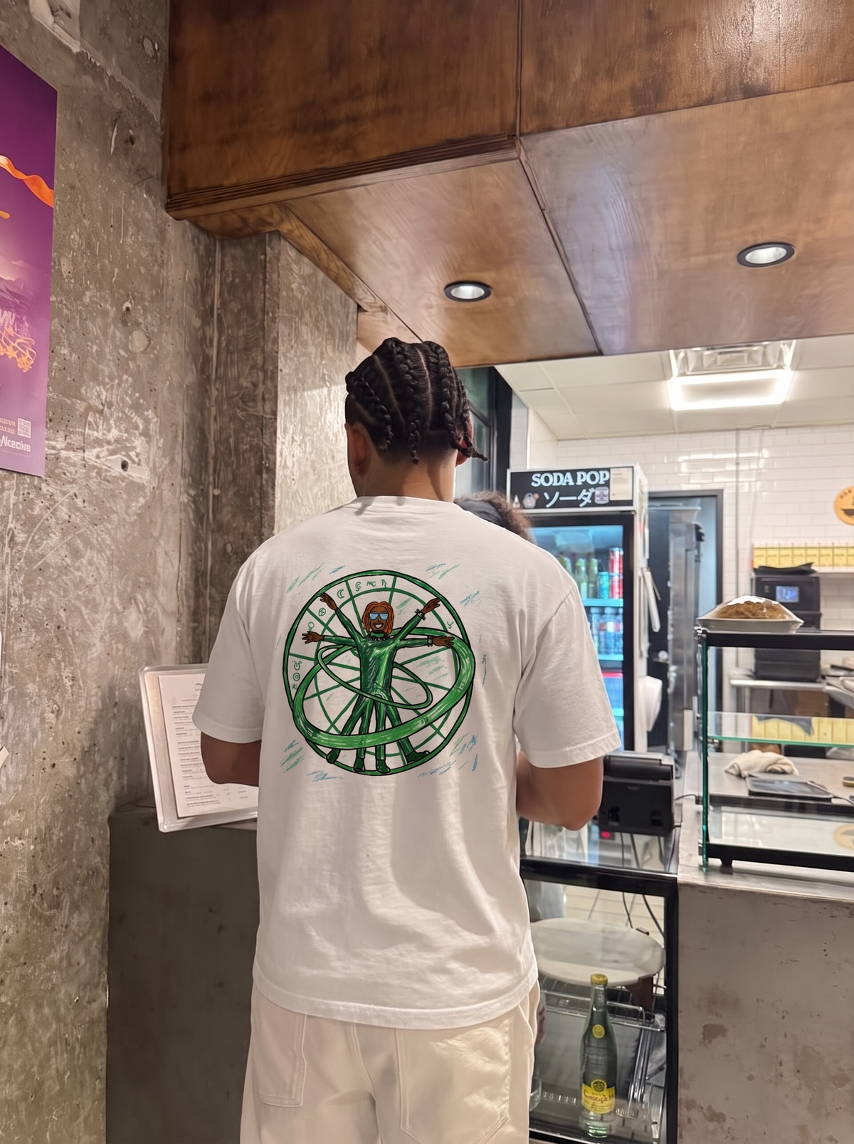 Wunna tee, back print worn in a café